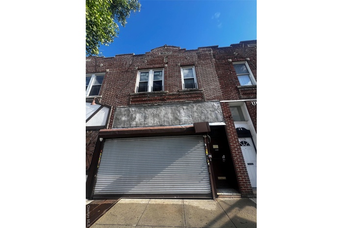 View of front of home featuring brick siding
