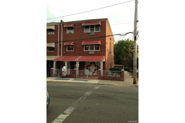 View of front of house featuring brick siding