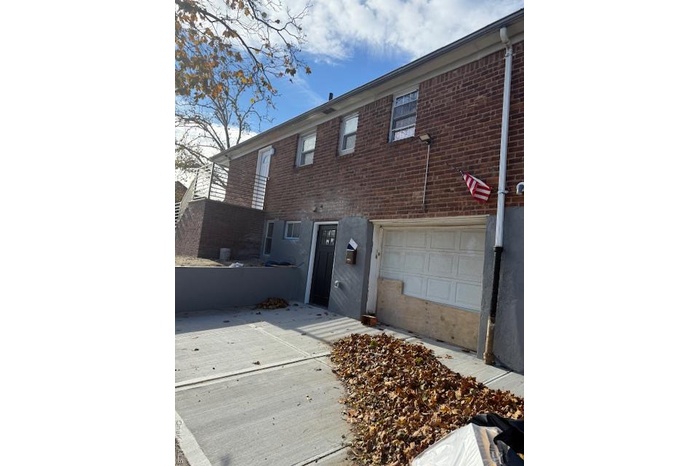 Traditional-style house with brick siding