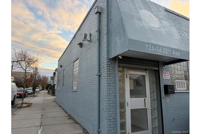 View of property exterior featuring brick siding