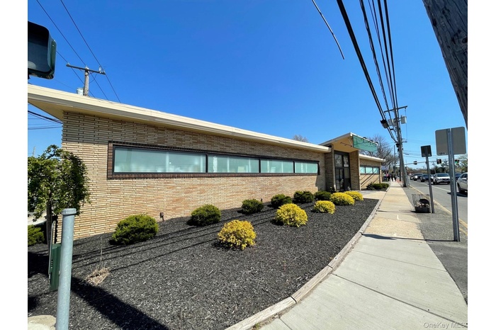 View of side of home featuring brick siding