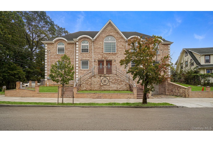 Traditional home with brick siding