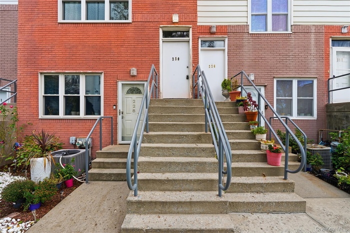 Entrance to property featuring brick siding