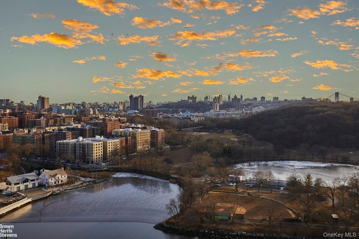 View of city skyline with a large body of water