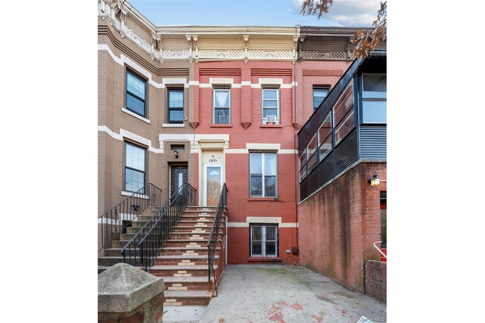 View of front facade featuring brick siding