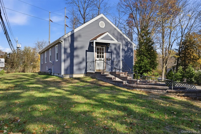 View of front of home with a front yard