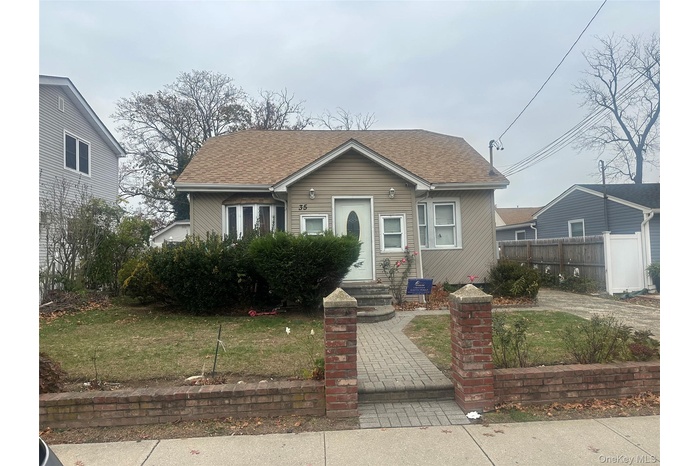 Bungalow-style house with a shingled roof