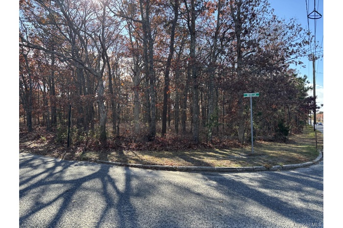 View of asphalt road with curbs