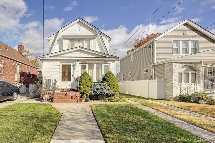Colonial inspired home with a gambrel roof