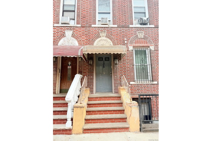 Property entrance with brick siding