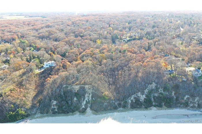 Aerial overview of property's location featuring waterfront location