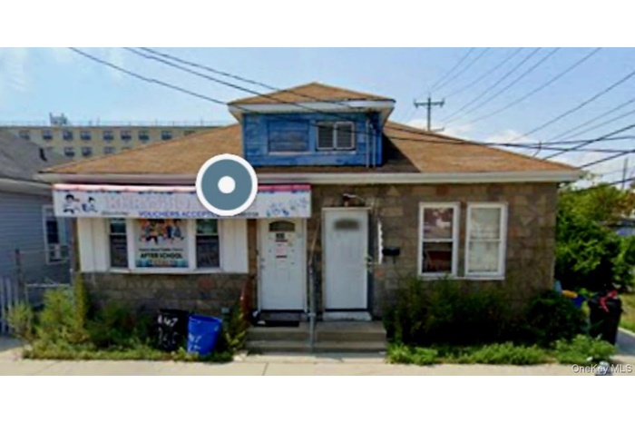 Bungalow-style home with stone siding