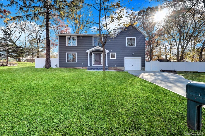 Traditional home featuring driveway and a garage