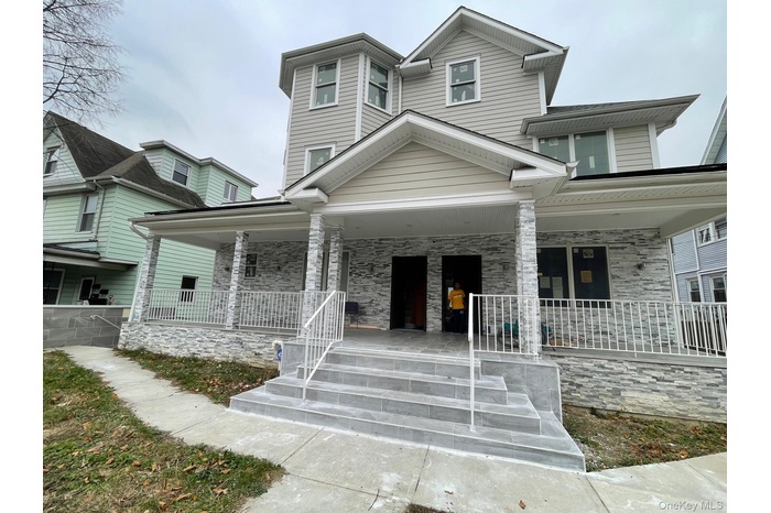 View of front of home with covered porch