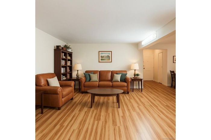 Living area with light wood-type flooring and baseboards