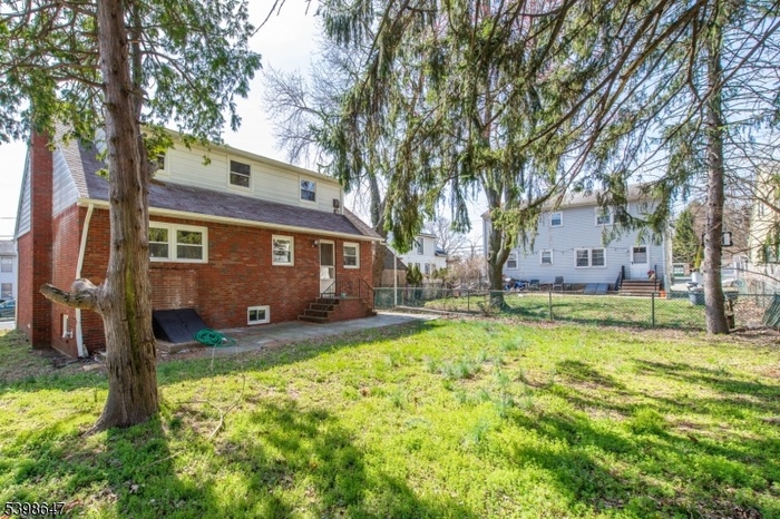 REAR OF HOME AND YARD