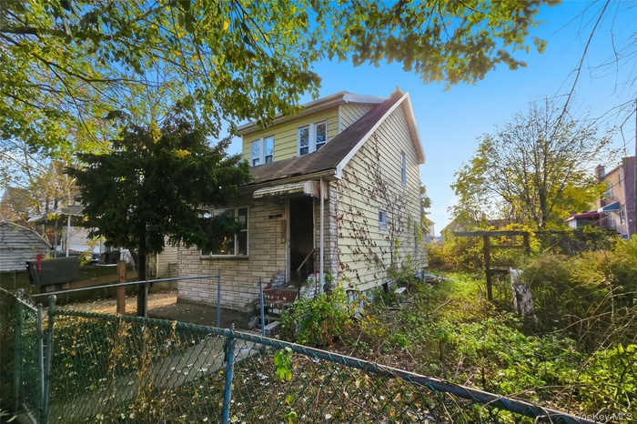 View of side of home with stone siding