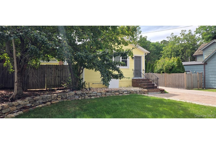 View of property hidden behind natural elements