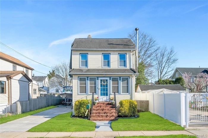 View of front of home with a shingled roof