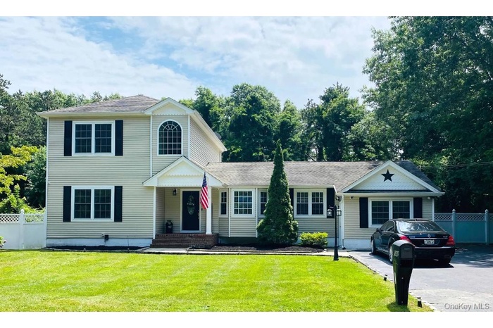 View of front of home with roof with shingles