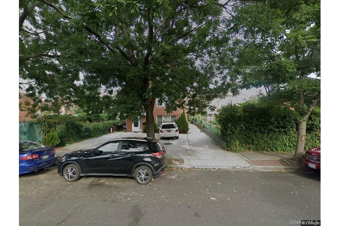 View of property hidden behind natural elements