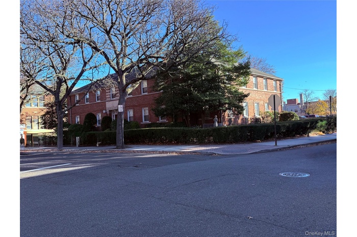 View of front of house featuring brick siding
