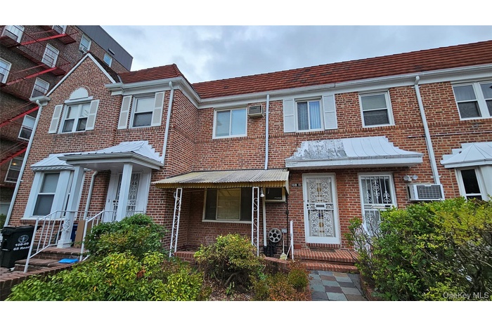 Traditional home with brick siding