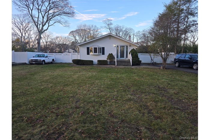 View of front of property featuring a fenced backyard