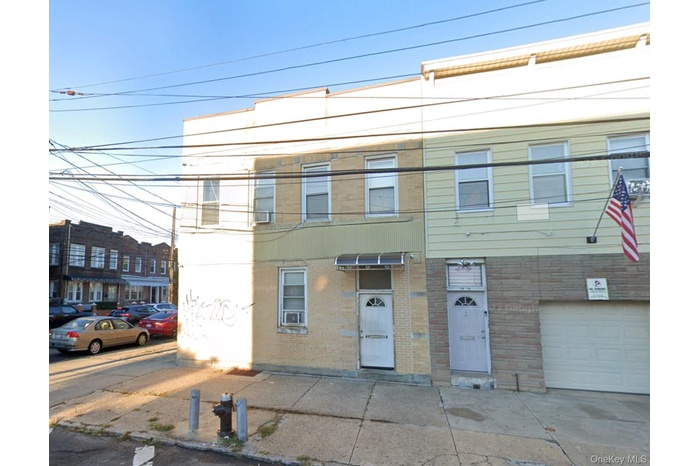 View of front of home featuring brick siding