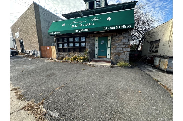 View of exterior entry with stone siding