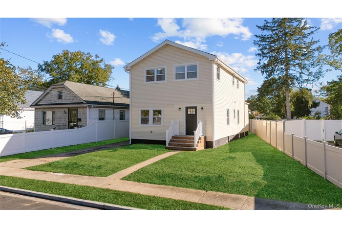View of front of home with a fenced backyard