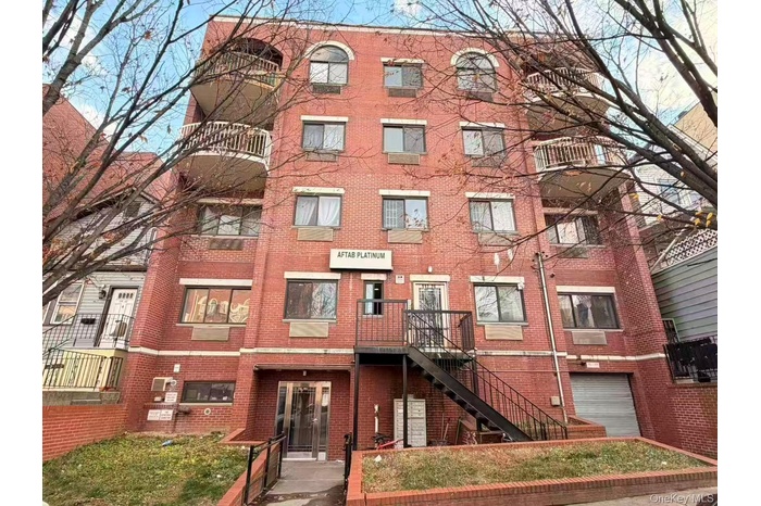 View of apartment building / complex featuring stairs