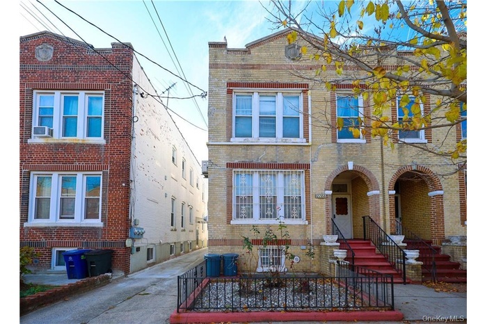 View of front facade featuring brick siding