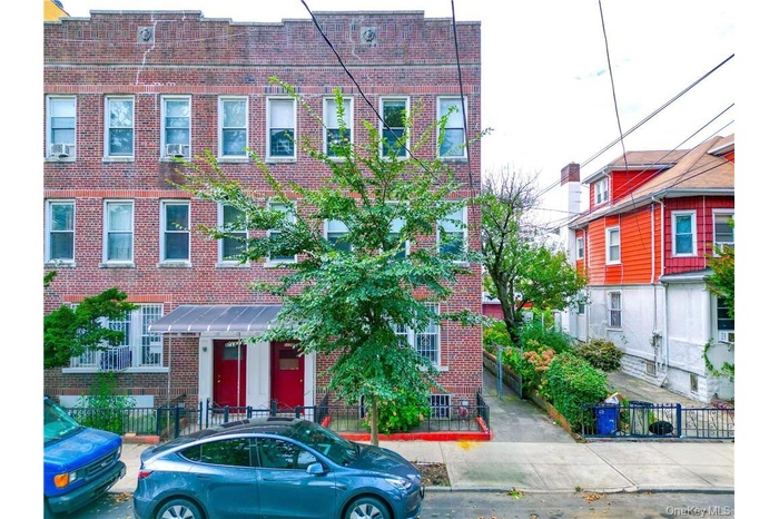 Traditional-style house featuring brick siding