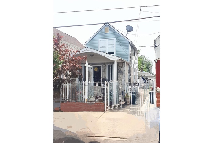 View of front of property with a gate