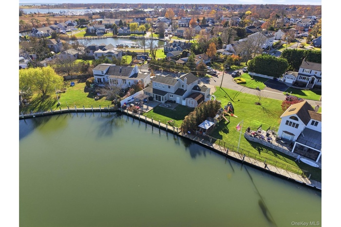 Aerial view of residential area with a nearby body of water