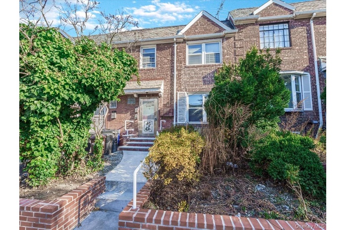 View of front of property with brick siding