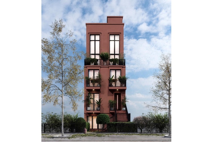 View of front of house featuring a balcony and stucco siding