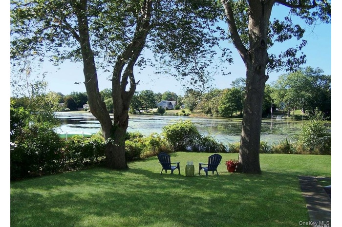 View of grassy yard featuring a water view