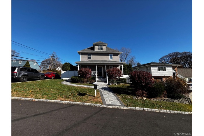 Traditional style home with covered porch