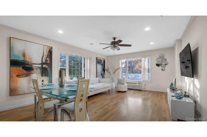 Dining space featuring light wood finished floors, a ceiling fan, ornamental molding, and recessed lighting