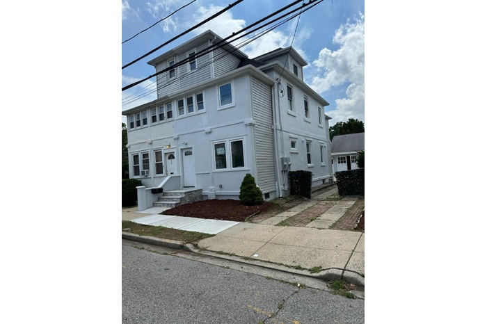 View of front of house featuring stucco siding