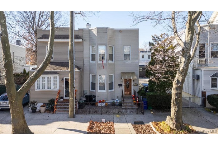 View of front facade with a gate and entry steps