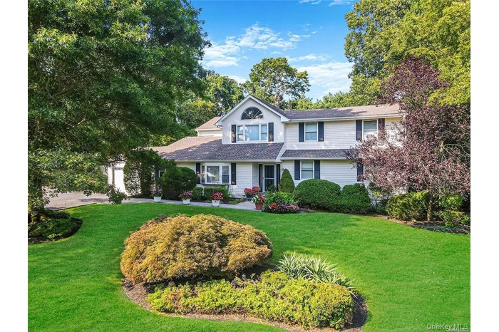 Traditional home with a front lawn