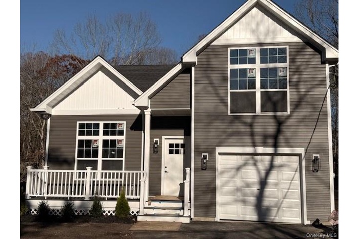 View of front of property featuring an attached garage