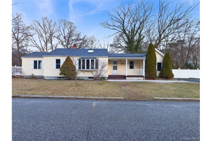 Single story home with a porch and a chimney