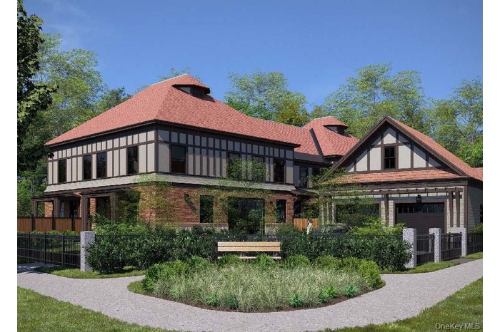 View of front of home featuring a shingled roof and a balcony