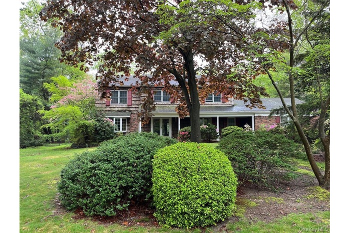View of front of house with a front yard