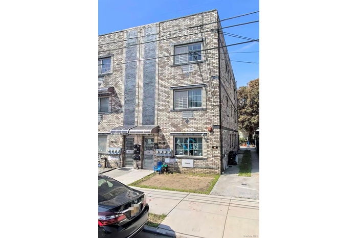 View of front of house featuring brick siding