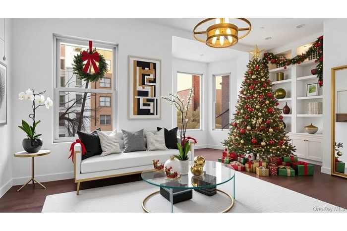 Sitting room featuring dark wood-style flooring and a chandelier